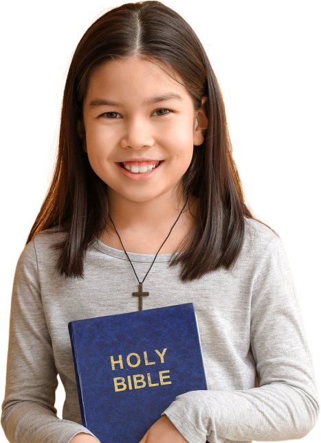 kid smiling while holding bible