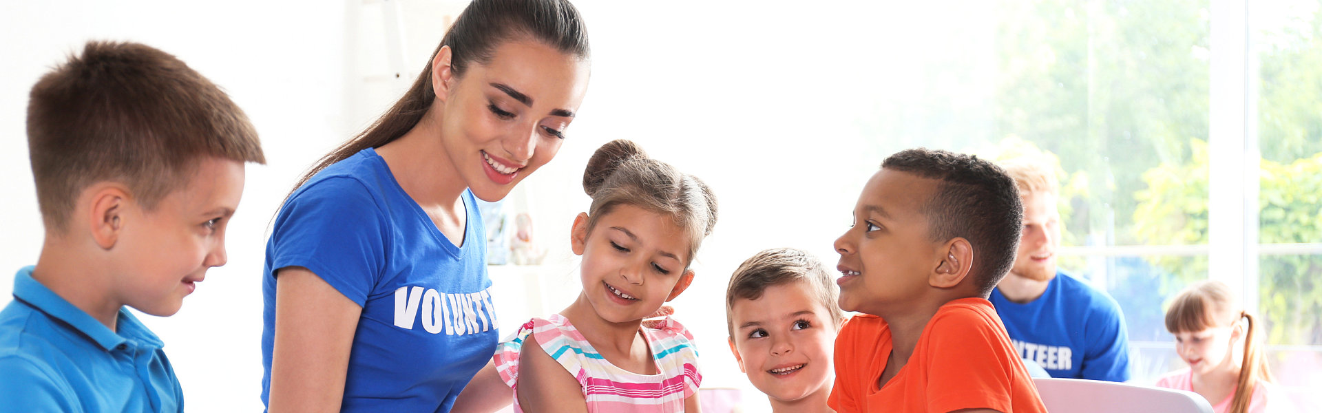 young with kids smiling