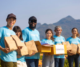 group of volunteers holding donations