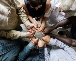 group of christian people praying together