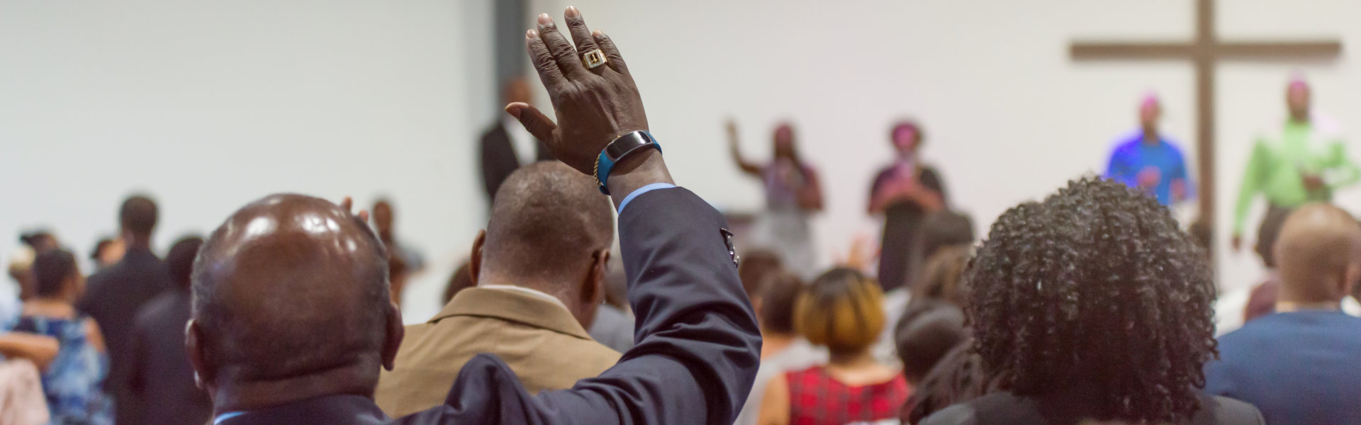 Man at Church with His Hand Raised