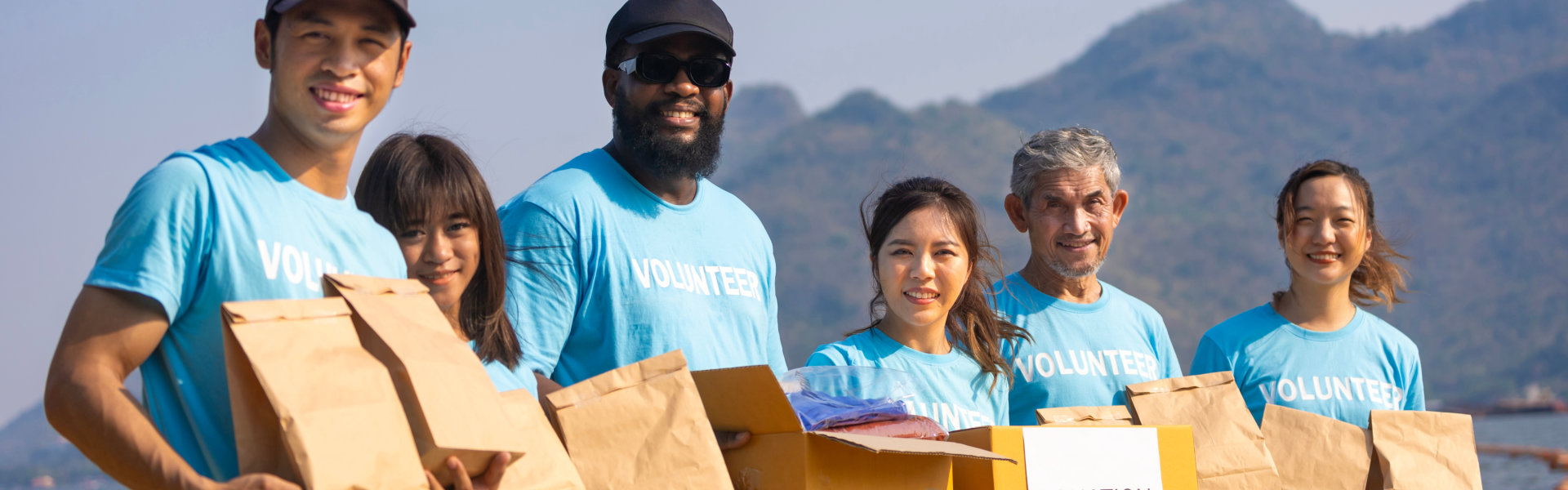 group of volunteers holding donations